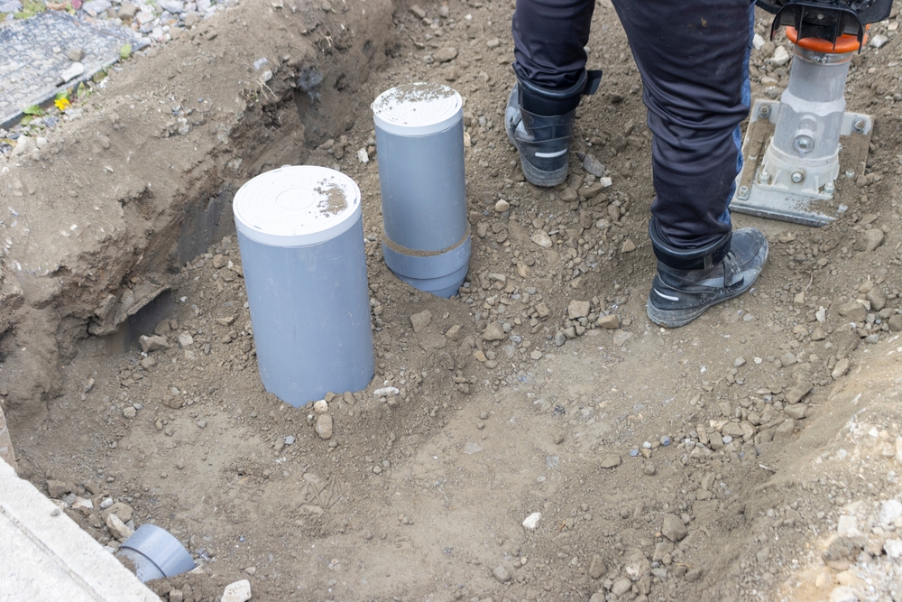 A person who performs plumbing work to connect residential drainage to the sewer system