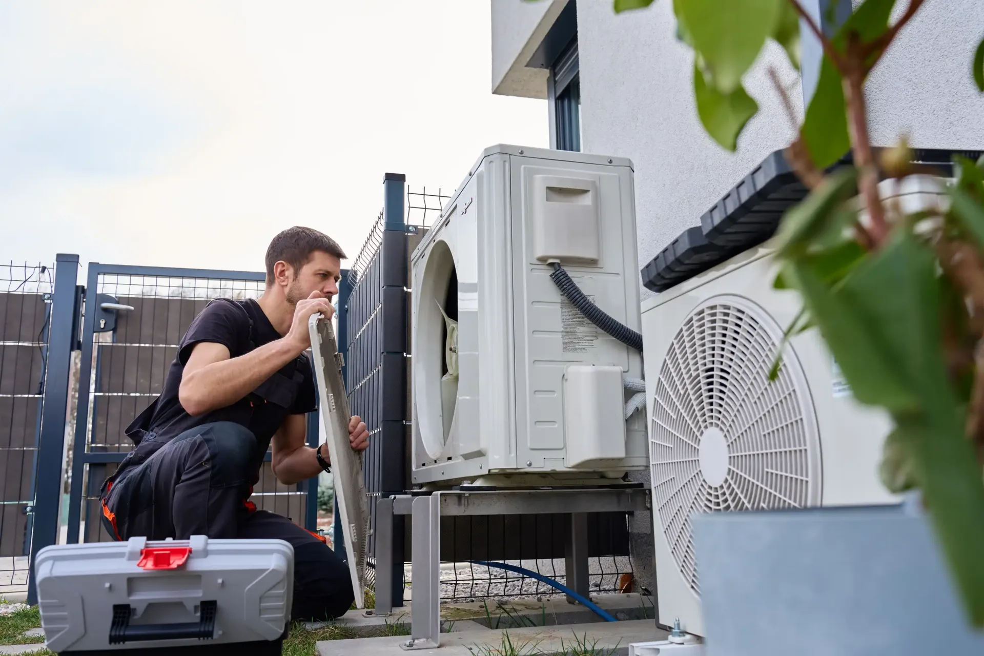 Focused hvac technician installing air conditioning service