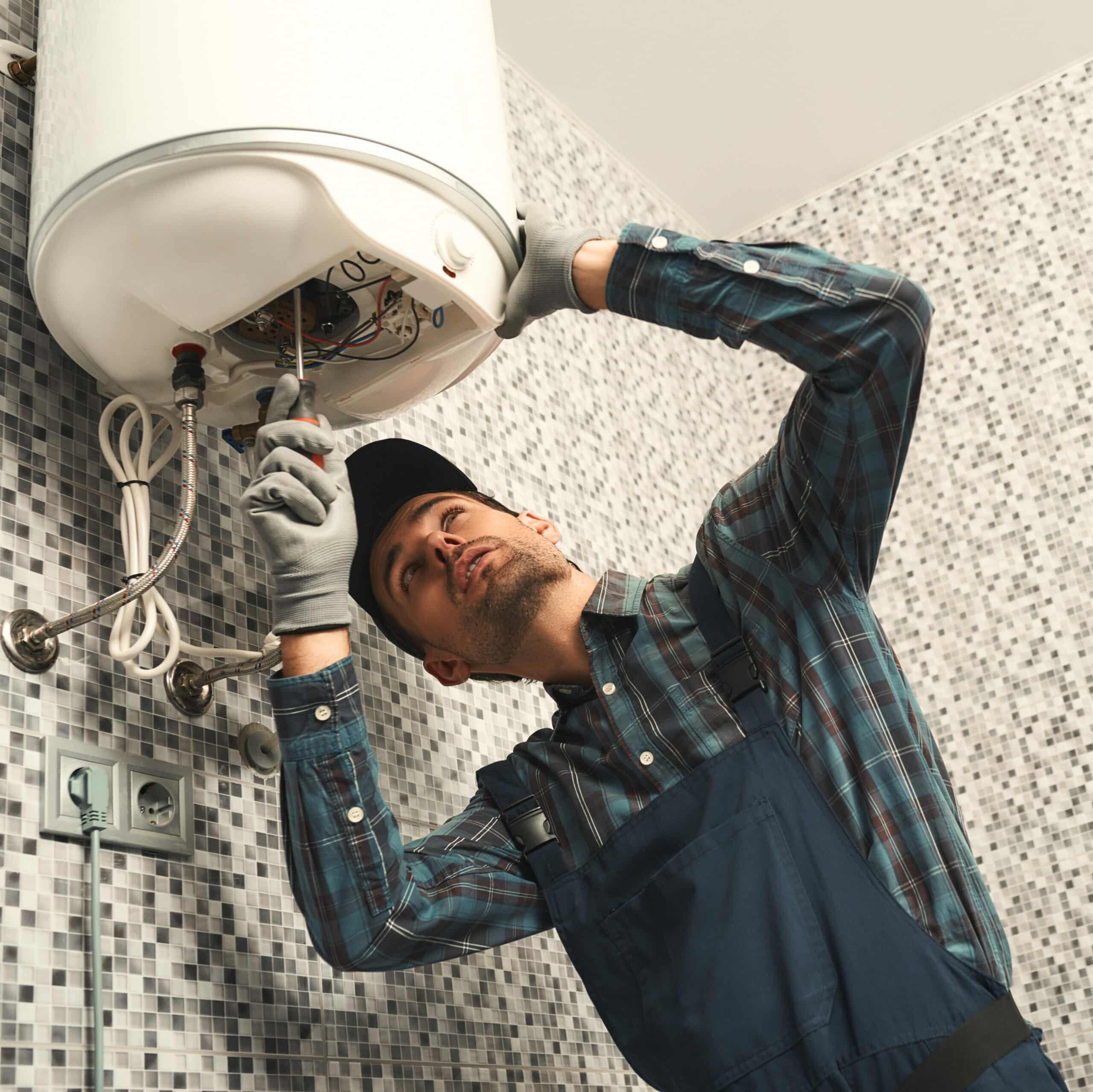 Plumber installing electric heatin